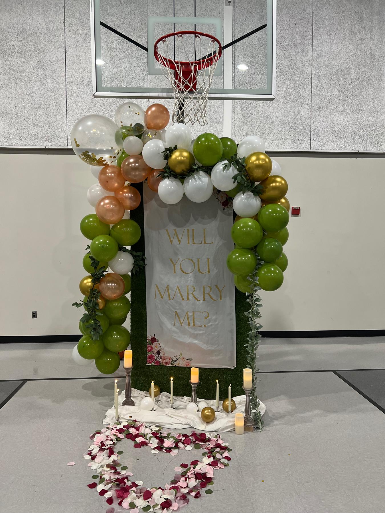 The proposal set up underneath the basketball hoop