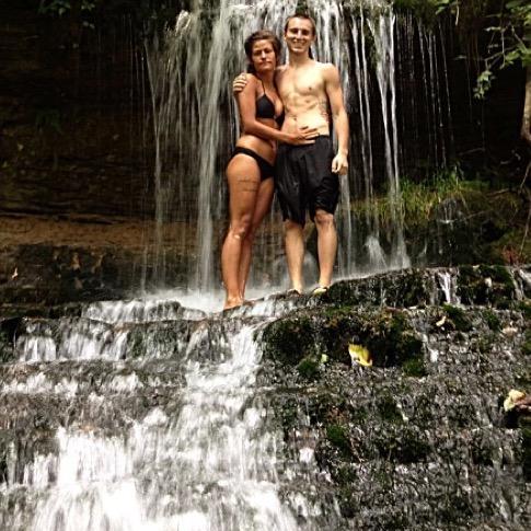First time I met his dad, he took us on a walk down the river and we decided to get a picture up on this waterfall, we look like the water isn't as cold as it actually was!