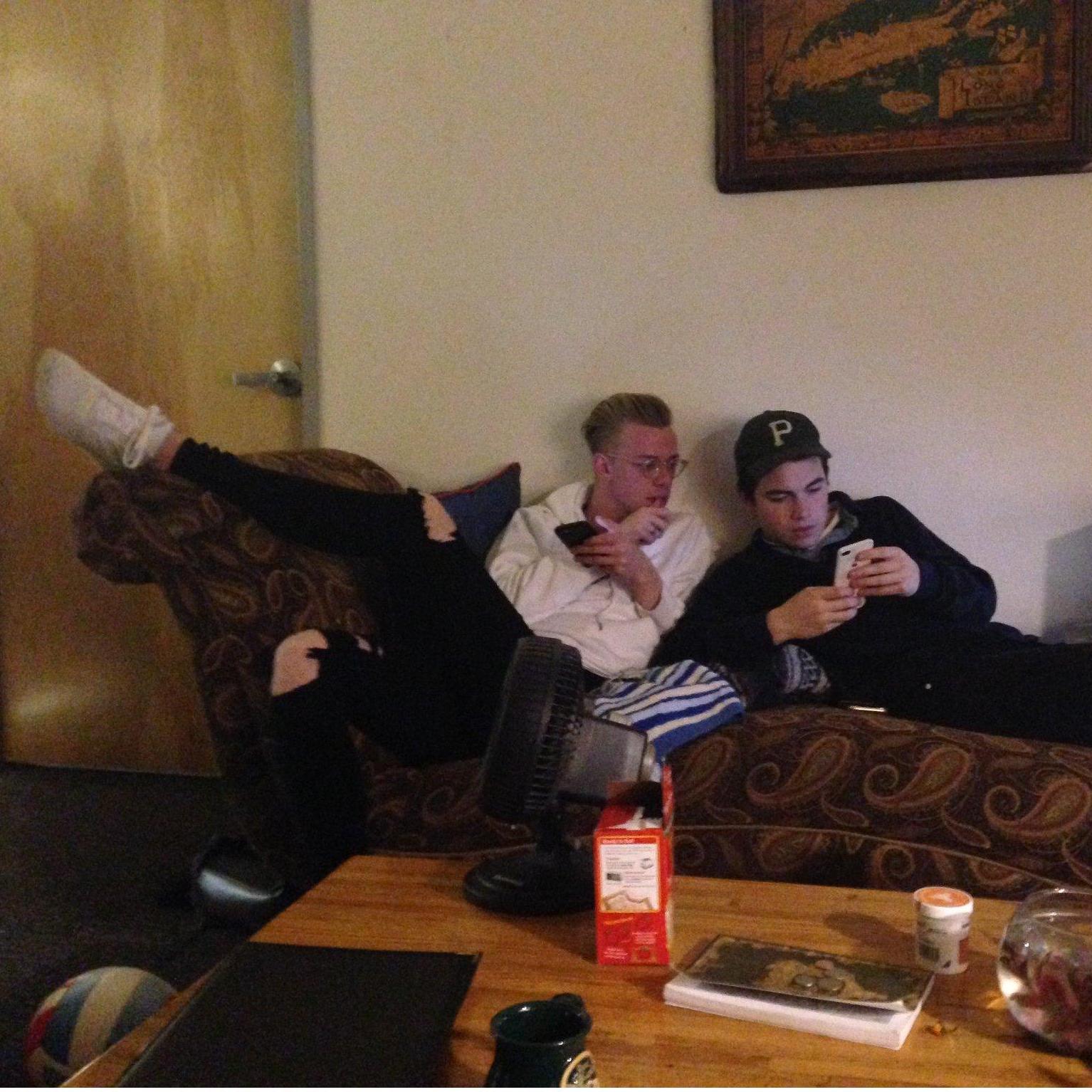 Isaac & Caleb Wiseman in Isaac's GCU dorm room in 2019 on a chaise lounge they found for free with Madison