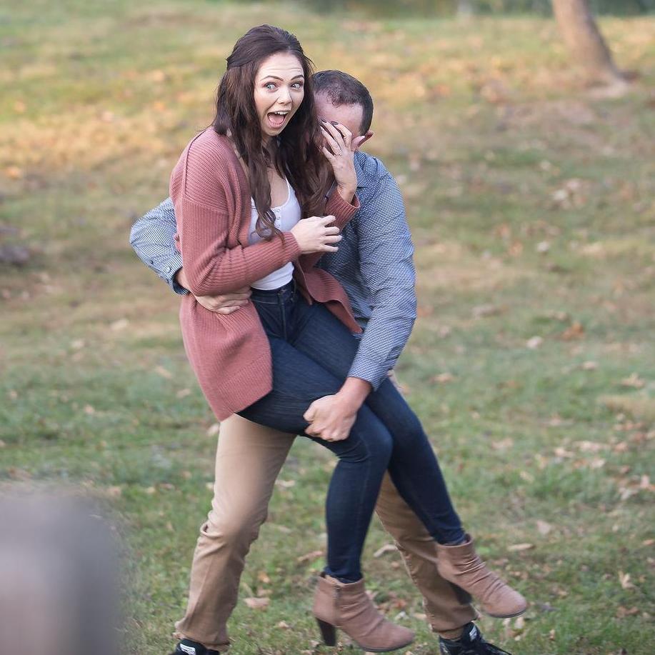 Jordan ran up behind Emily and picked her up. She had no idea he was going to do this.