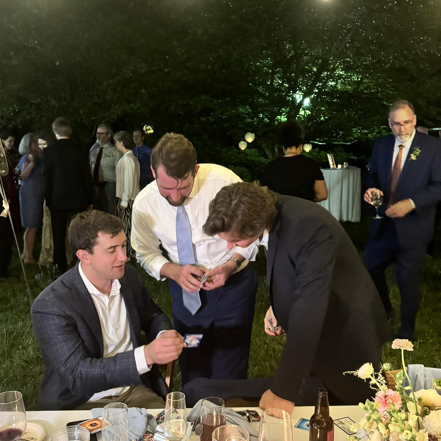 Robert and some old friends trading Pokemon cards at Nathan's wedding.