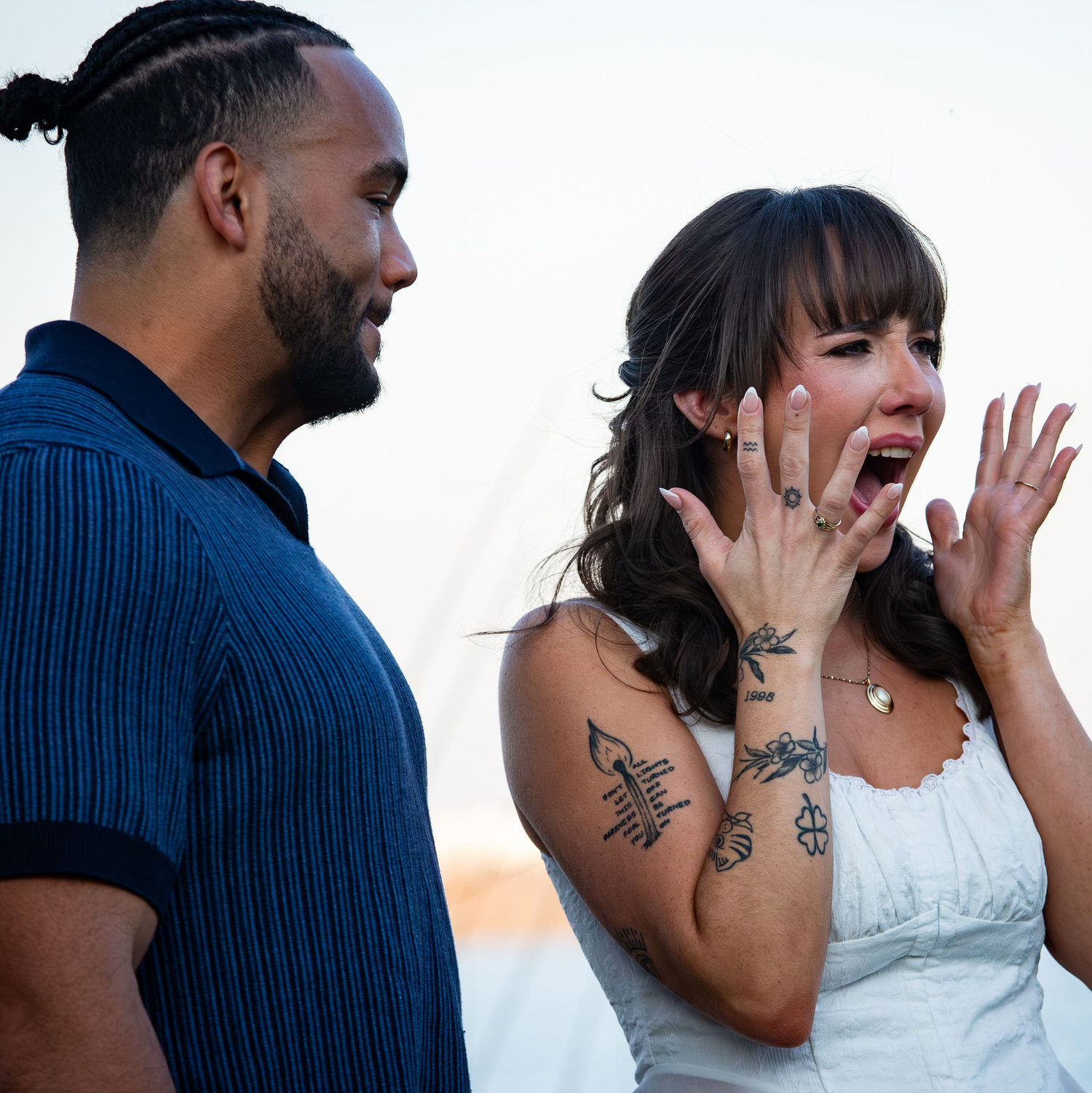 Lauren looked at him, and that's when he got down on one knee. To her surprise, she looked back to find all of their close family and friends celebrating.