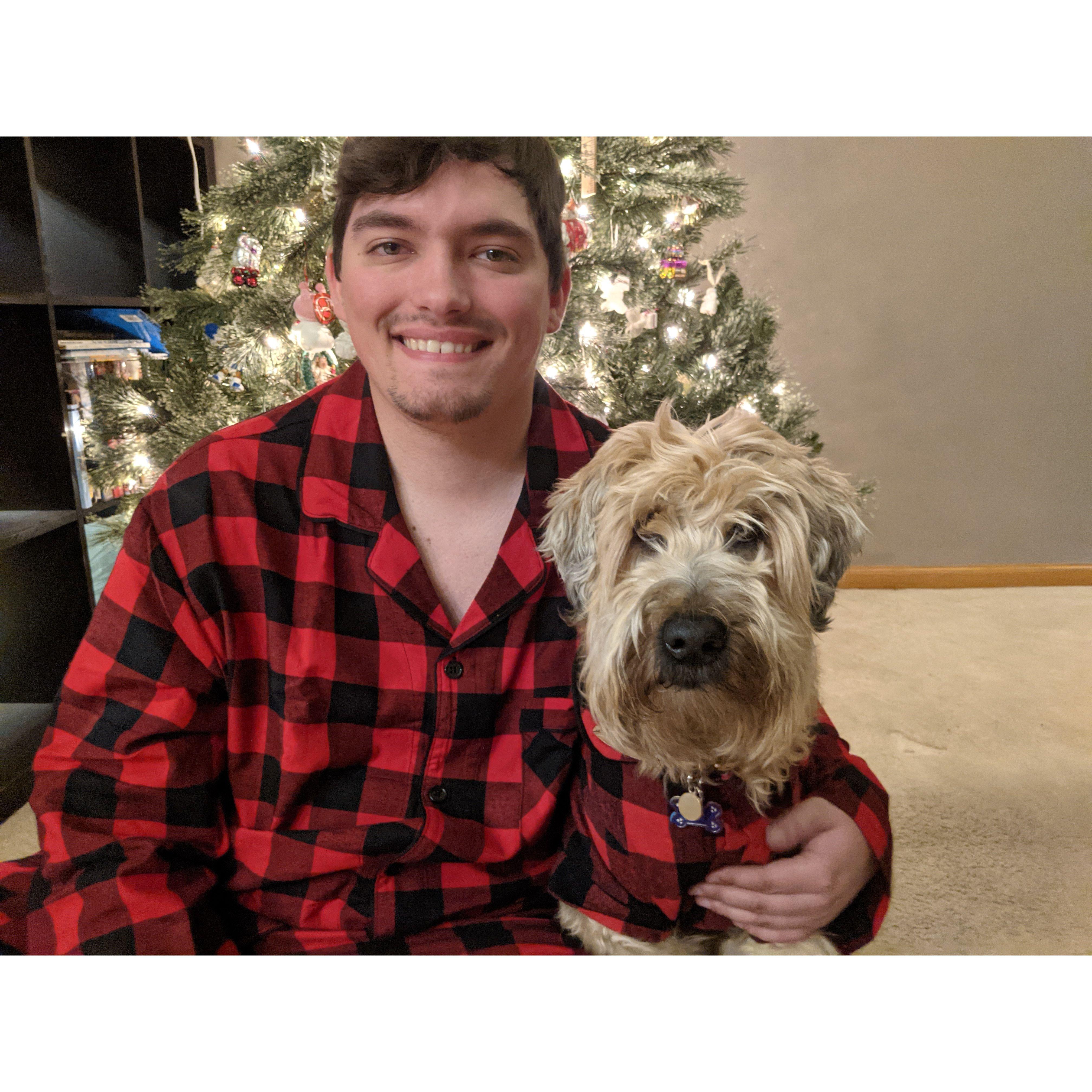 Tom and Olly in matching PJs posing for a Christmas card photo in 2020.