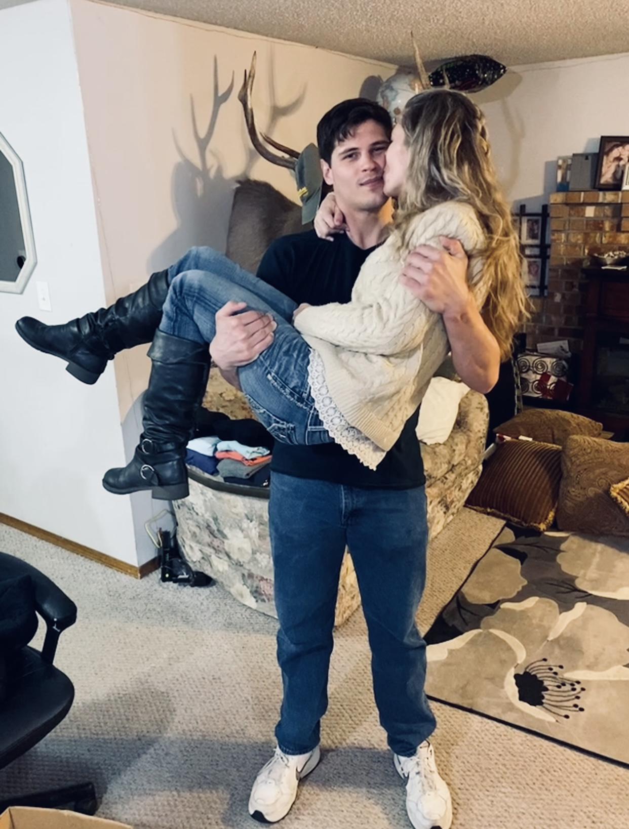 Brandon swept Tanna into his arms after she surprised him with new sets of clothes.