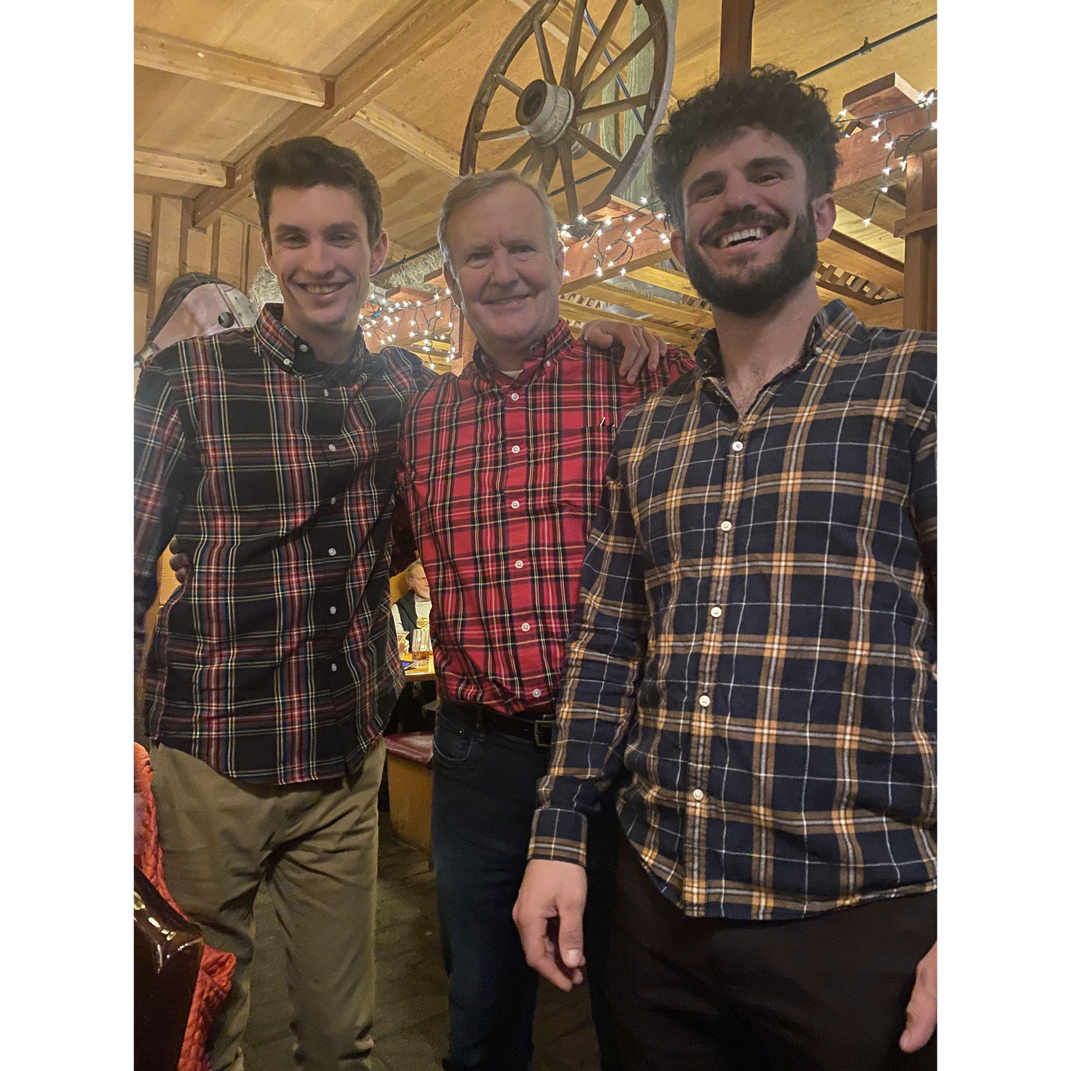 Dom with Dakota's dad Mike and brother Cooper on a very plaid Christmas Eve