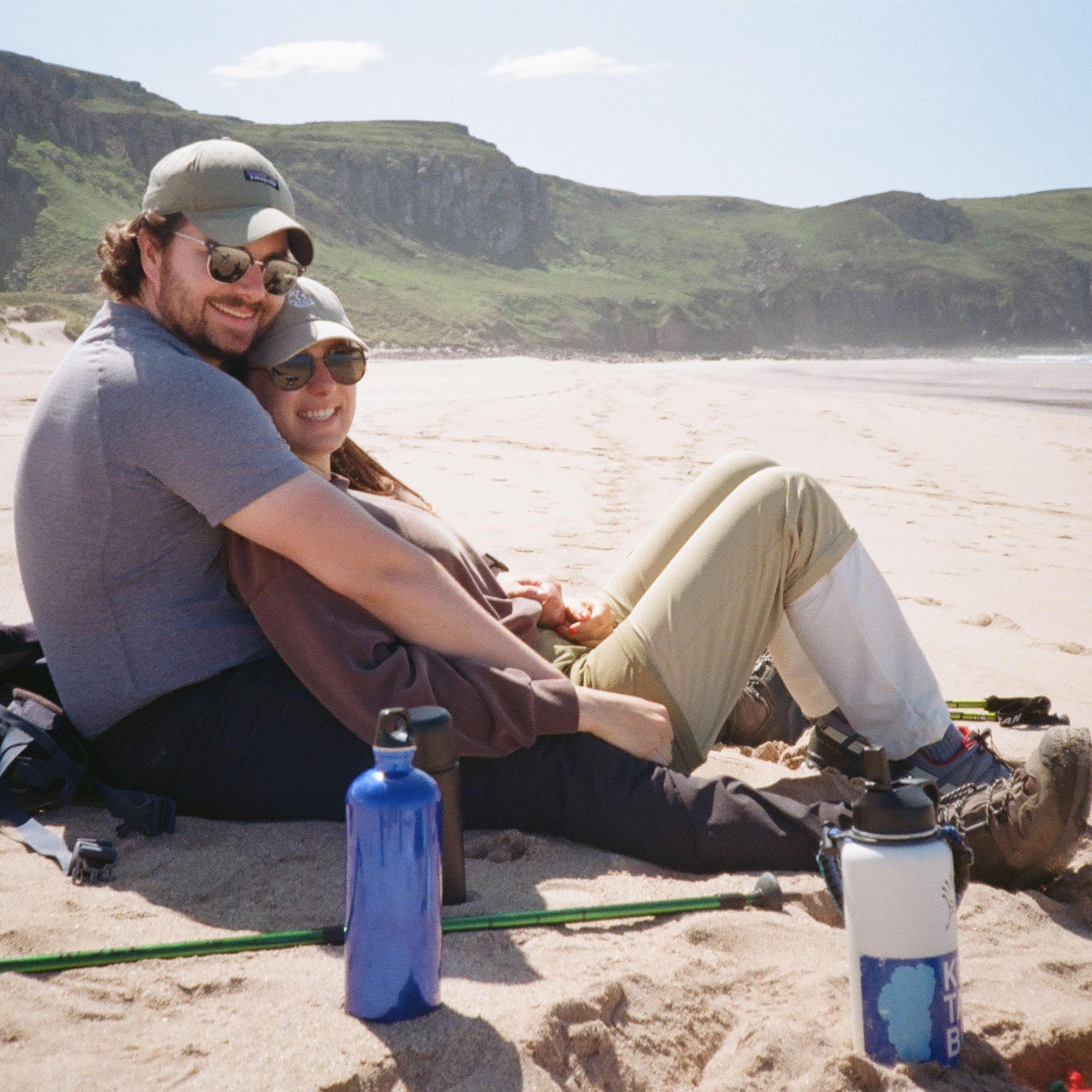 On a beautiful Scottish beach after a long hike with Peter's mom in 2024. Snacks and a cuddle were well-deserved!