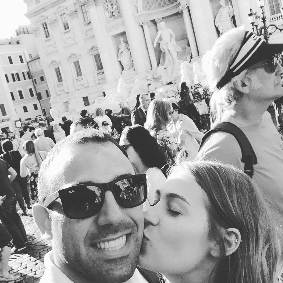 kisses and hugs in front of the Trevi Fountain