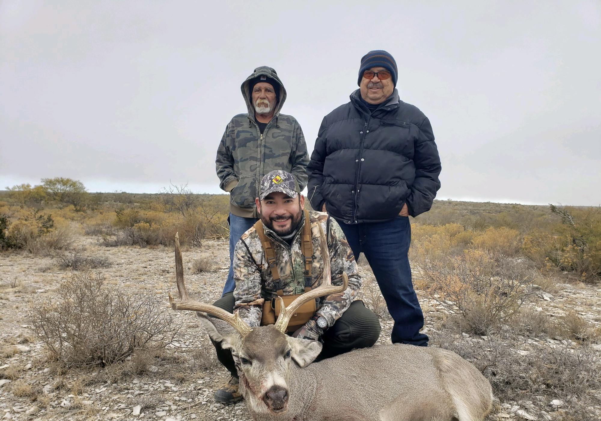 Michael showing off his hunt with Alba’s Dad, Antonio and family friend, Carlos