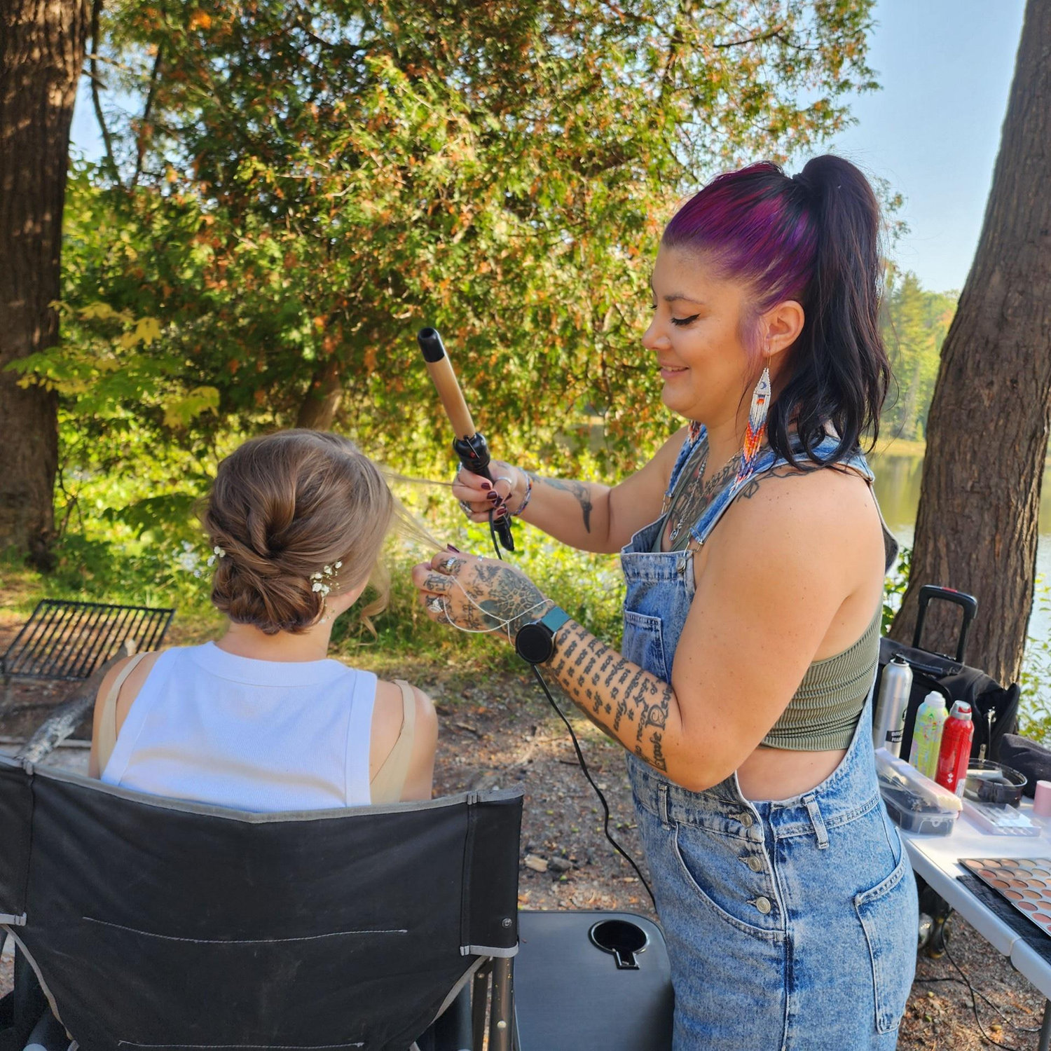 Sarah of Wild Bees Beauty doing my hair and makeup while butterflies land on us and squirrels yell at us to get off their lawn