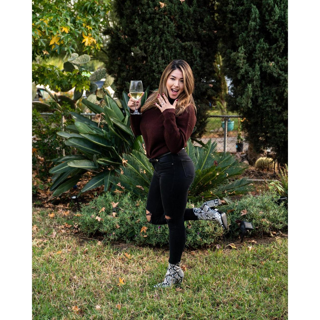 Natalie loves wine and snake skin boots.