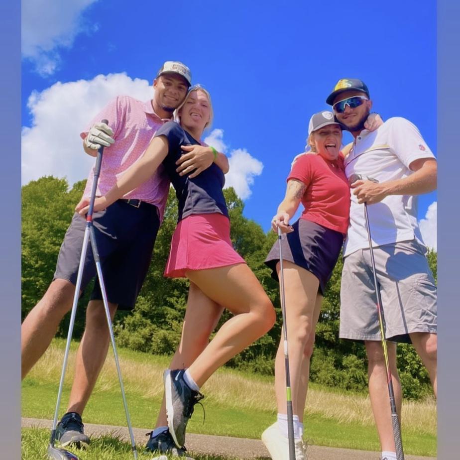 Best man, brides maid, bride, and groom golfing!