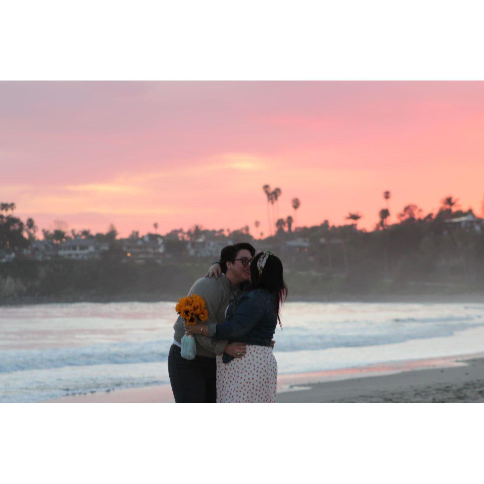 It has been pointed out to us that the palm trees behind us in this moment resemble a heart