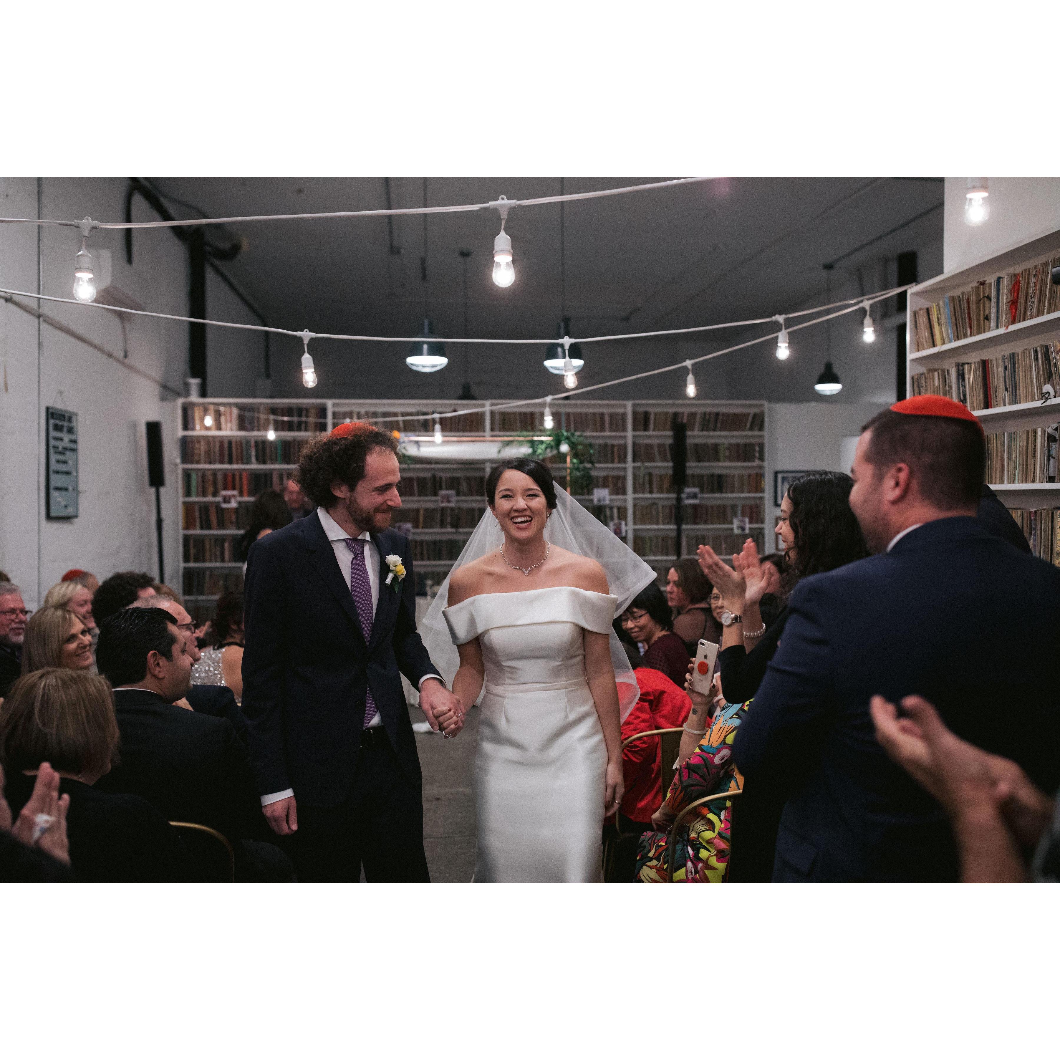dancing down the aisle as husband and wife.