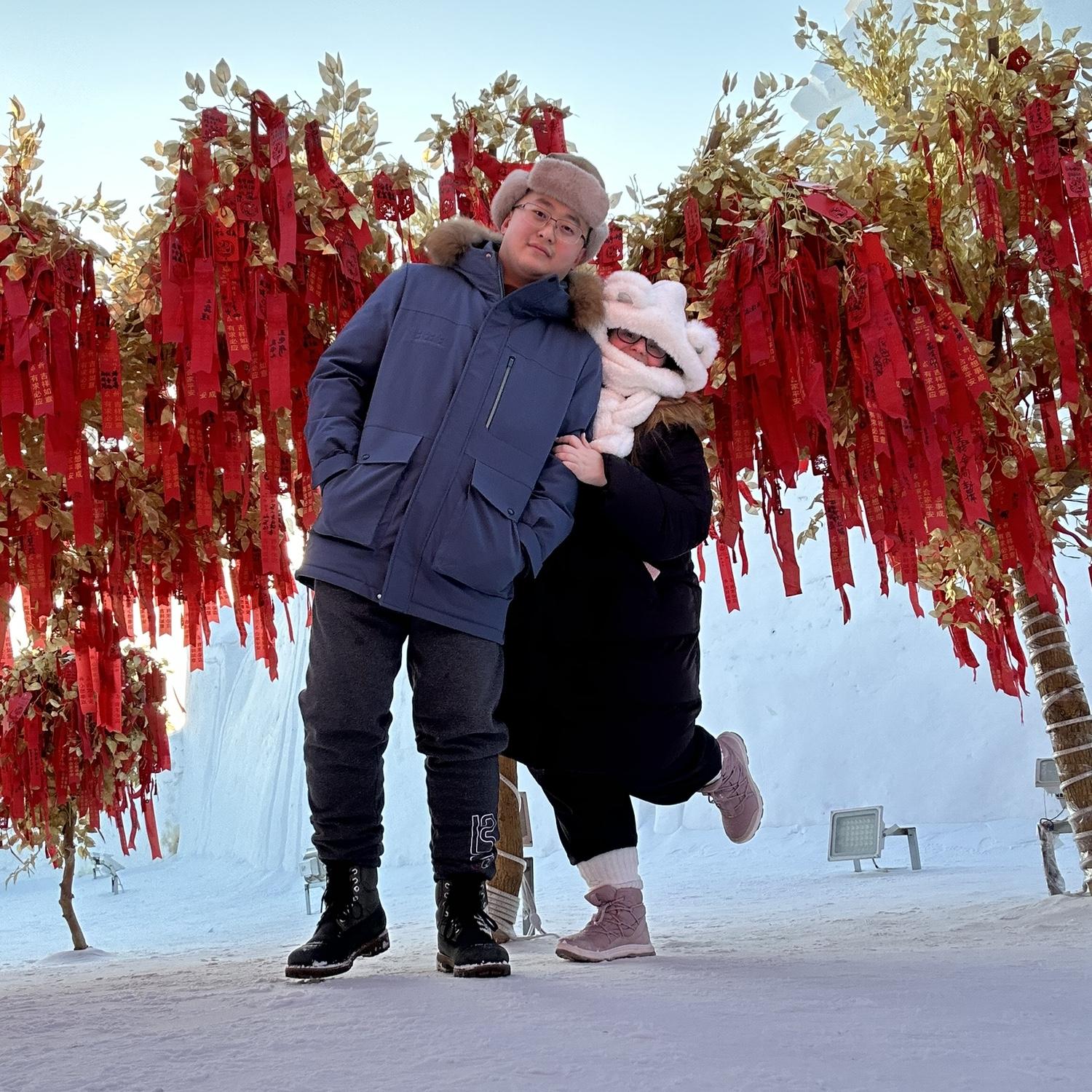 Haonan and Allison making a wish and enjoying the wishing trees.