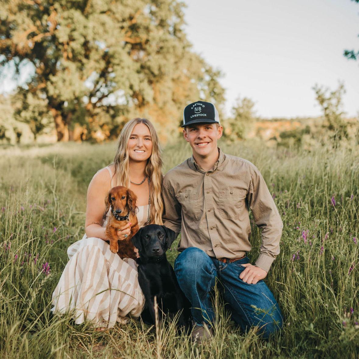 A picture of us and our fur babies, Wesson and Ruger. April 2025