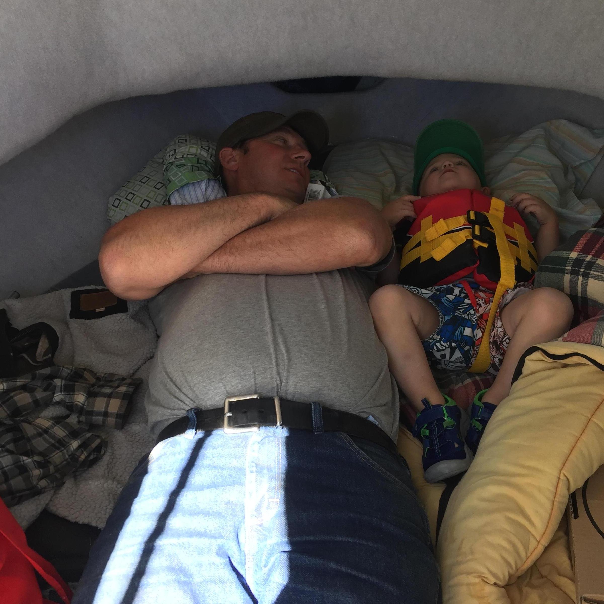 Grandpa George and Pax trying to nap on the boat!