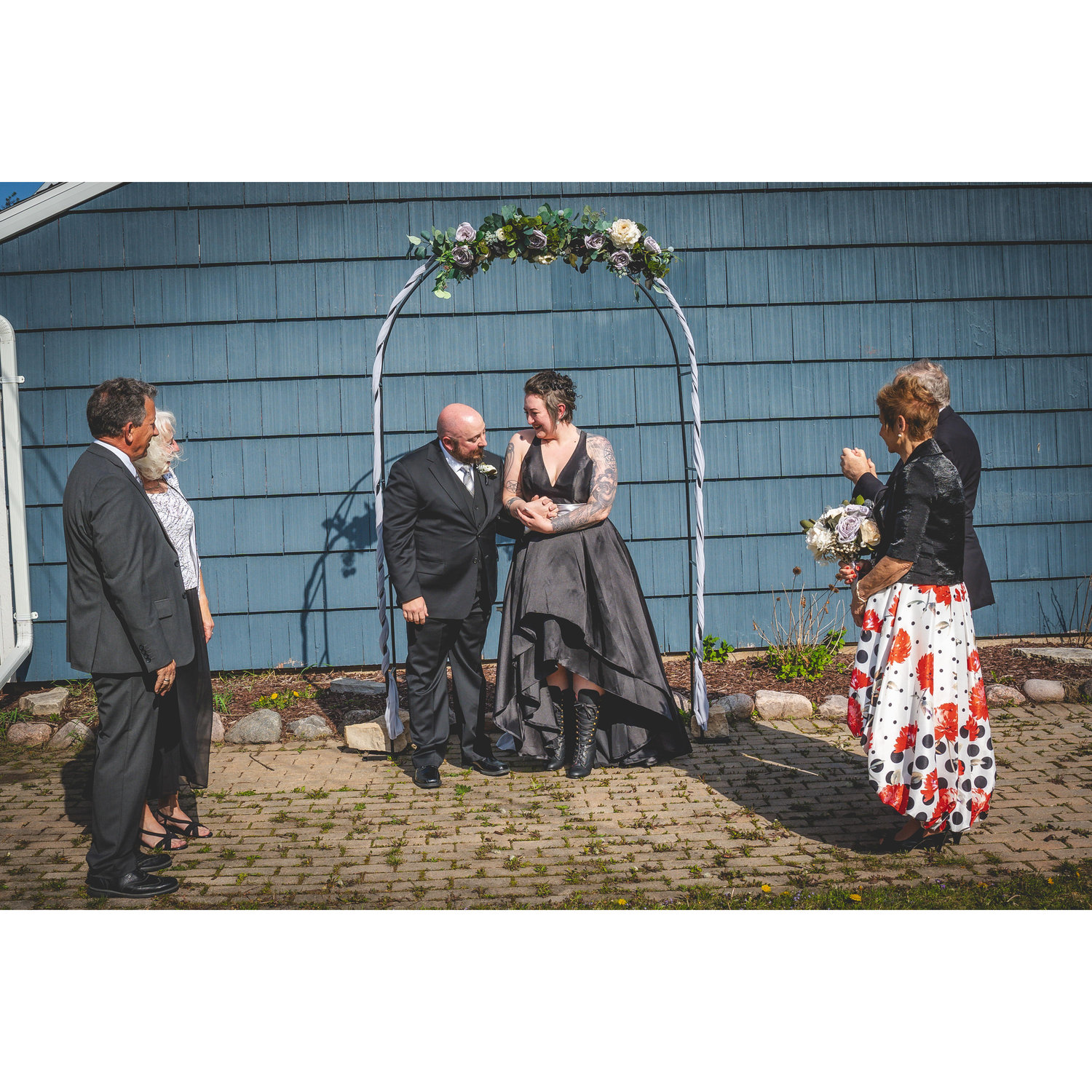 Overjoyed and in love! Surrounded by their proud parents.