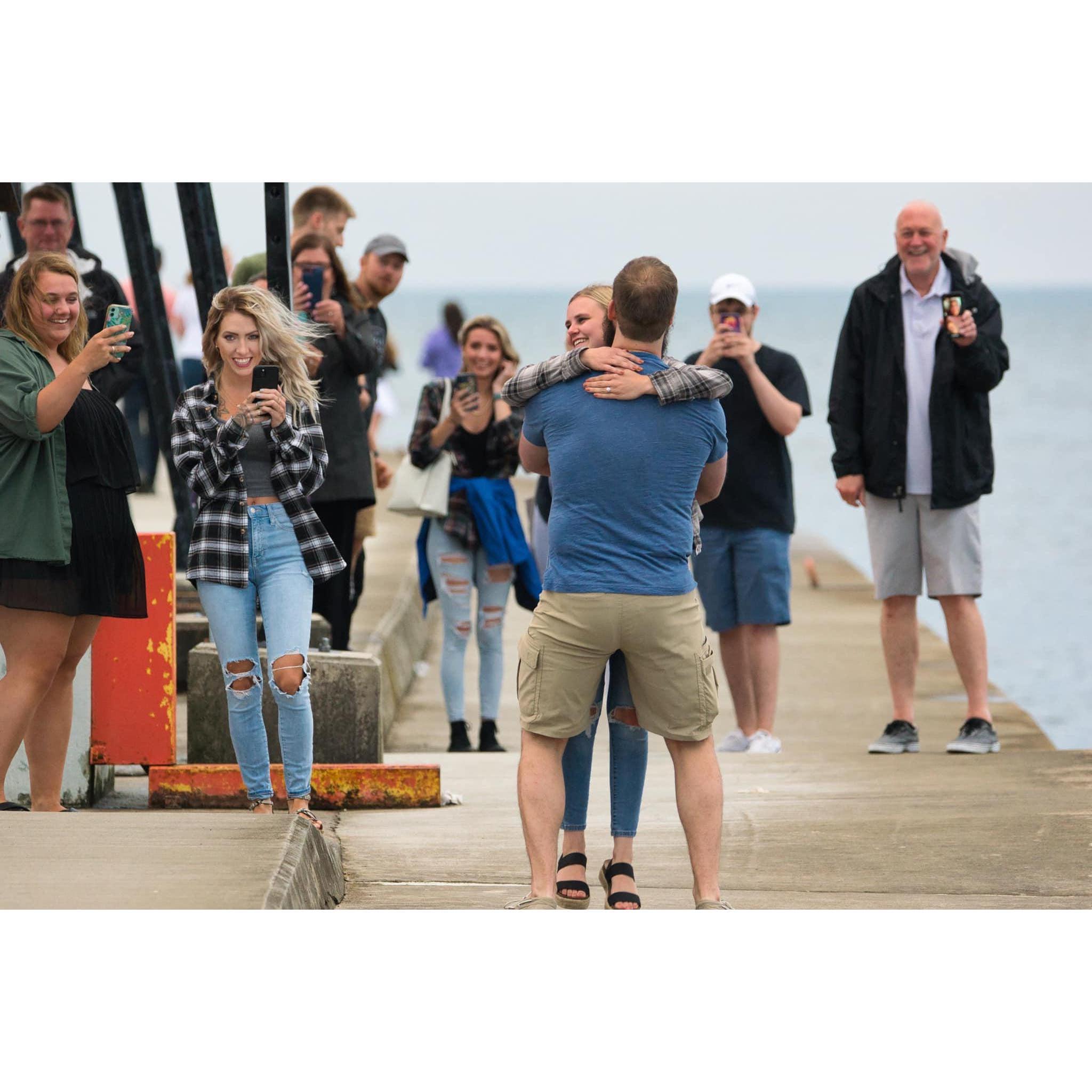 I had NO idea more of our friends and family were hiding at the pier and surprised me when we got engaged!