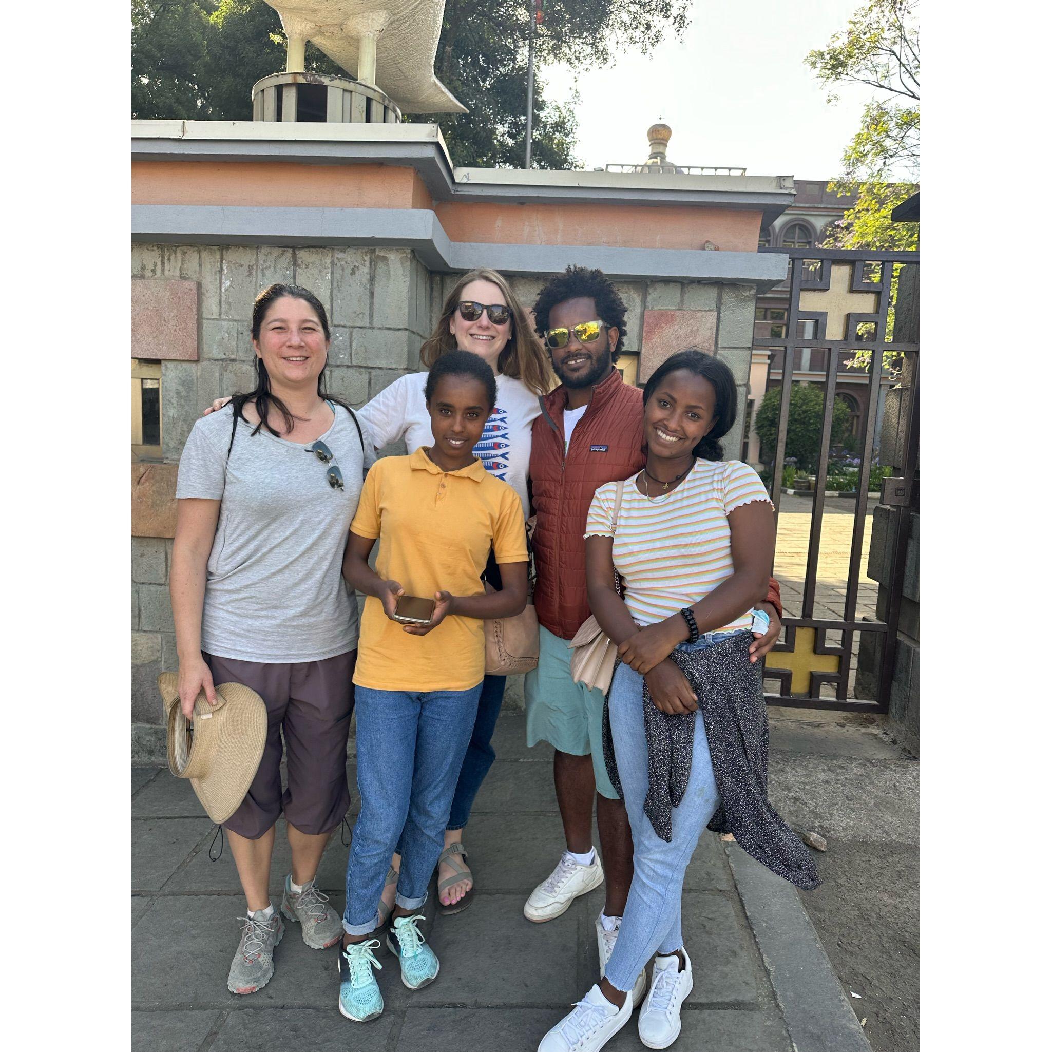 Happy tourists in front of Addis Ababa University!