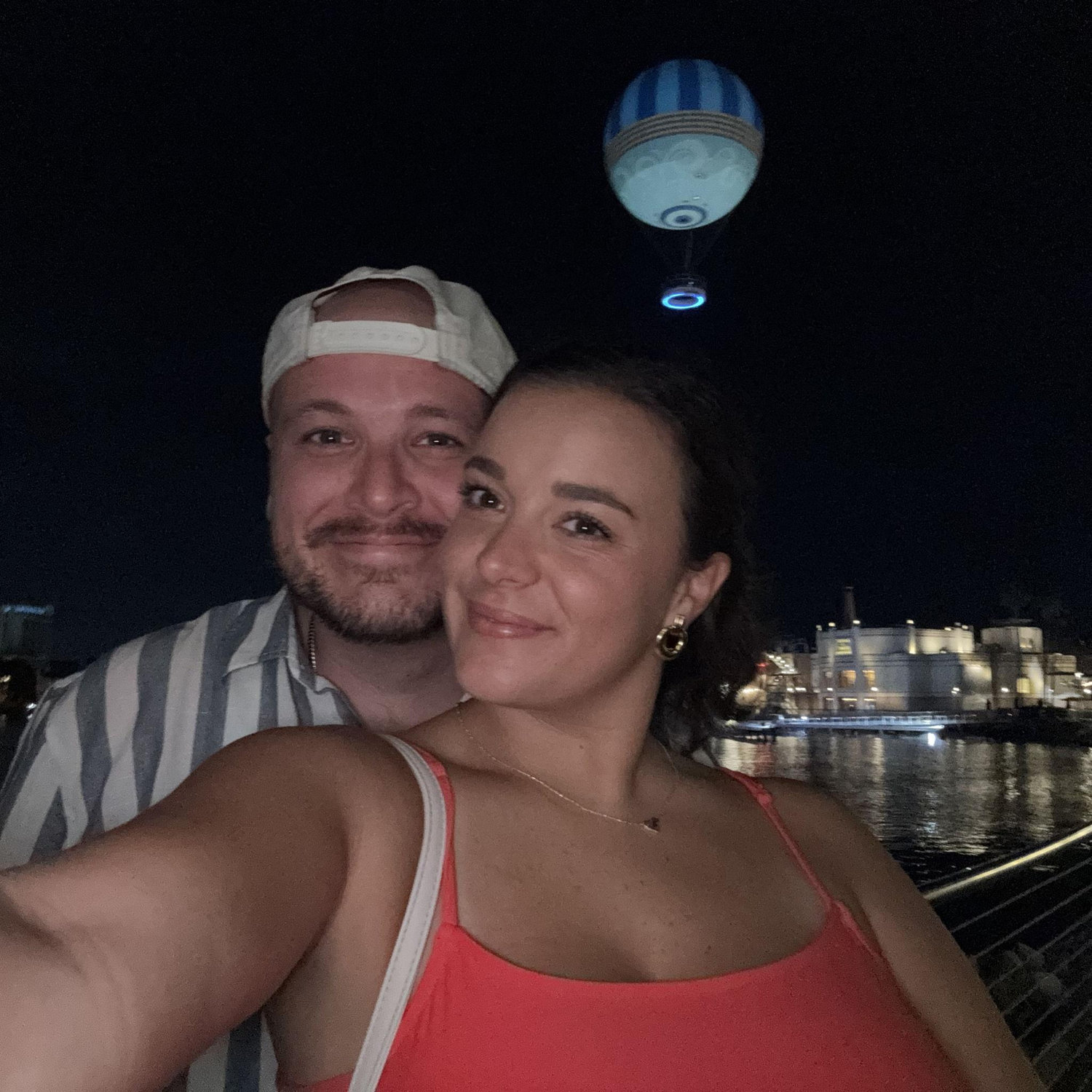 The night we got engaged! Right in front of a hot air balloon, next to the water, in Disney Springs. Just us two!