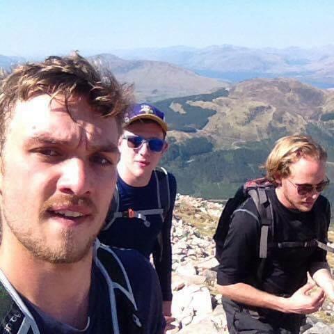Thomas, his groomsman Jamie, and friend Oliver hiking Ben Nevis (the UK's highest point)