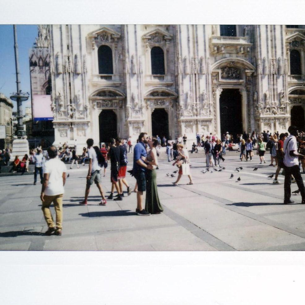 A smooch in front of the Duomo in Milan, 2015