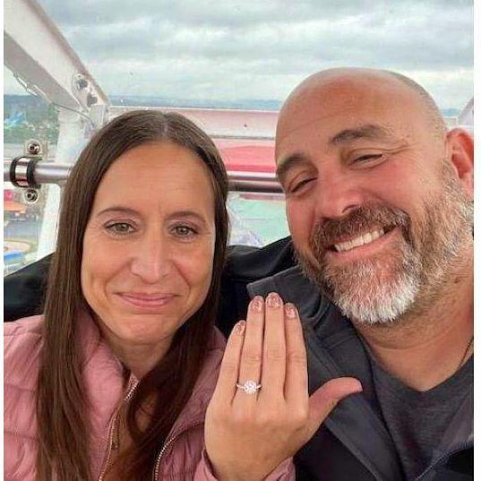 At the peak of the iconic Branson Ferris Wheel, which once graced Chicago's Navy Pier, he asked, and I said yes. A moment we'll cherish forever.