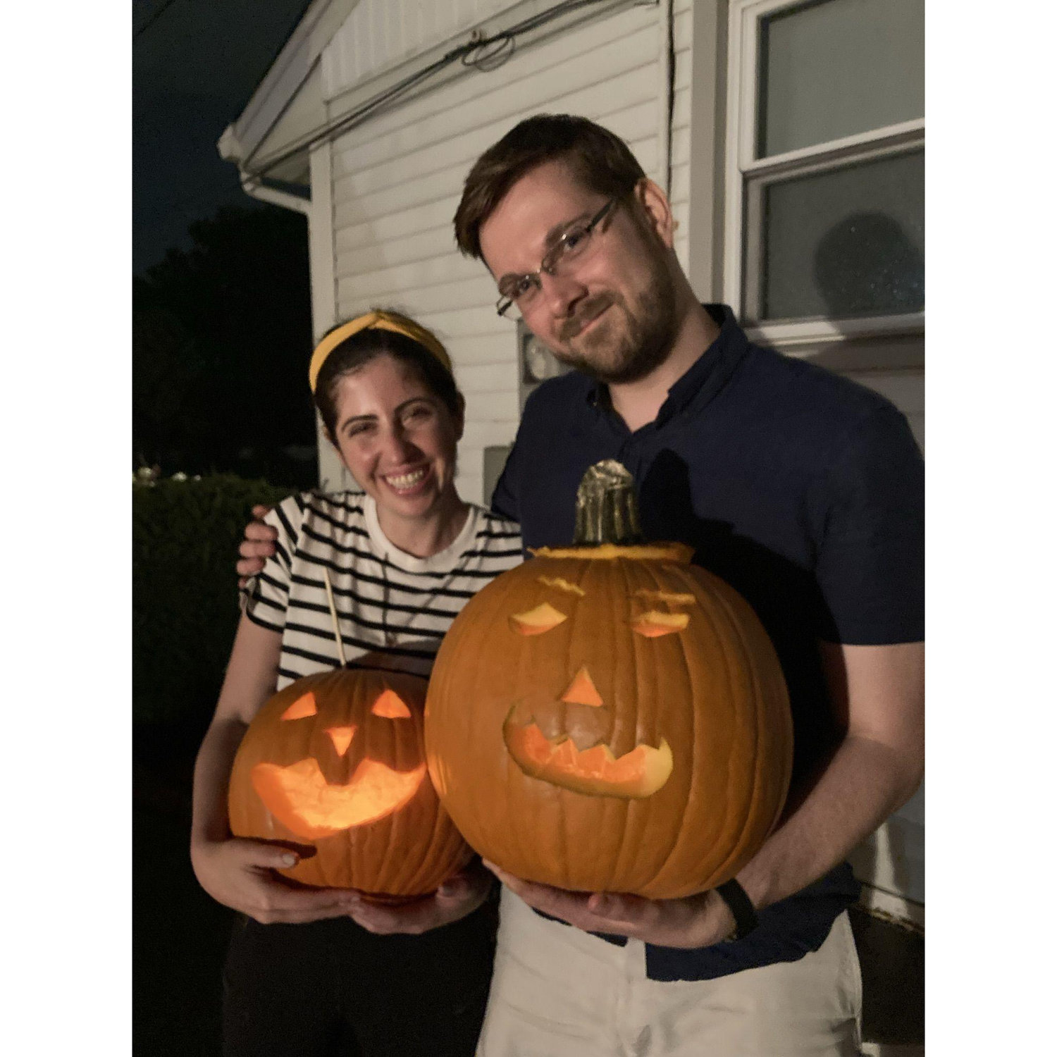 We bought these pumpkins at an apple orchard/pumpkin patch in rural Illinois on our first anniversary. Our friend Rosie was a much better carving helper than Kevin...