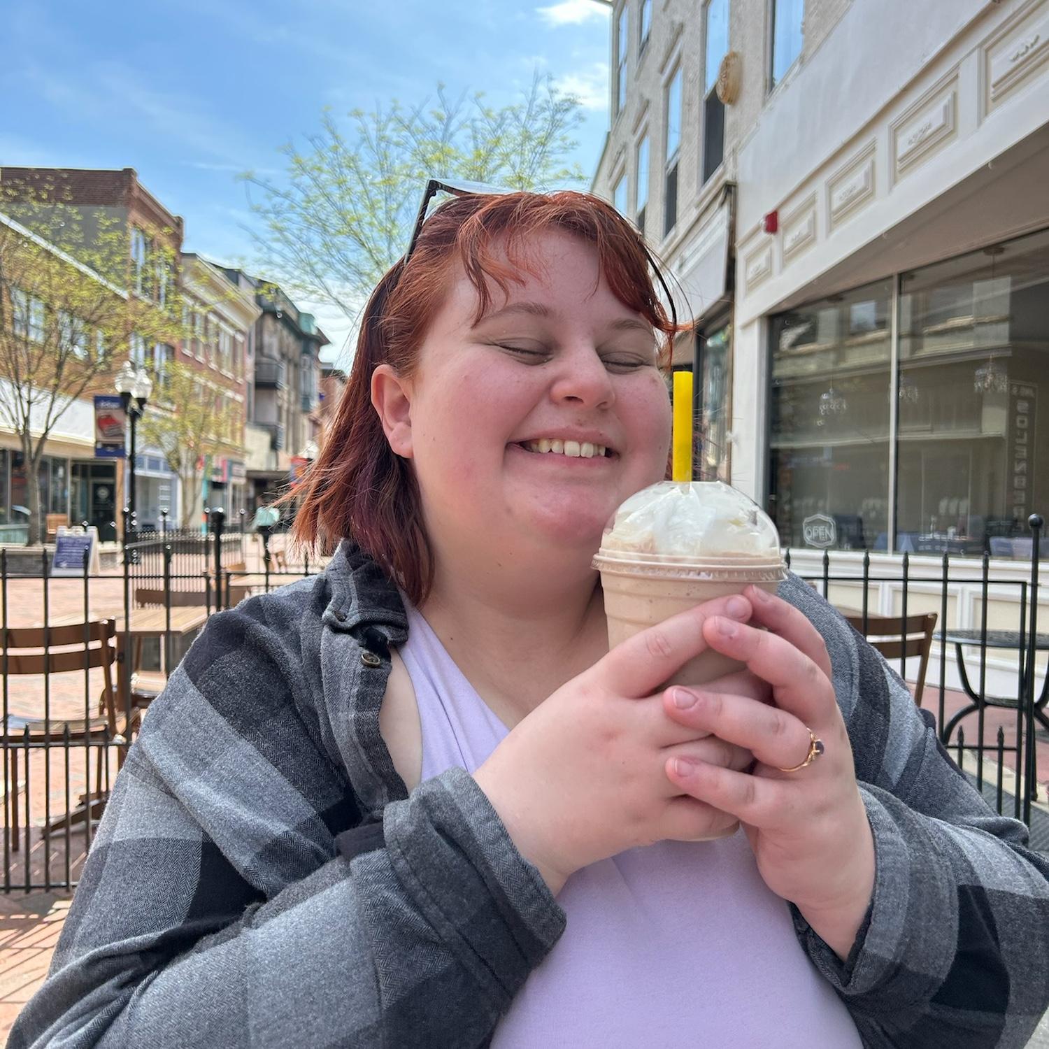 Sawyer enjoying a milkshake from Red Fox in Old Town