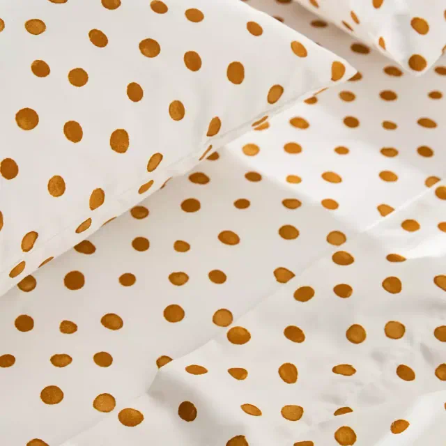 The Organic Cotton Sateen Printed Sheet Set by Maeve in Queen Ochre Polka Dot