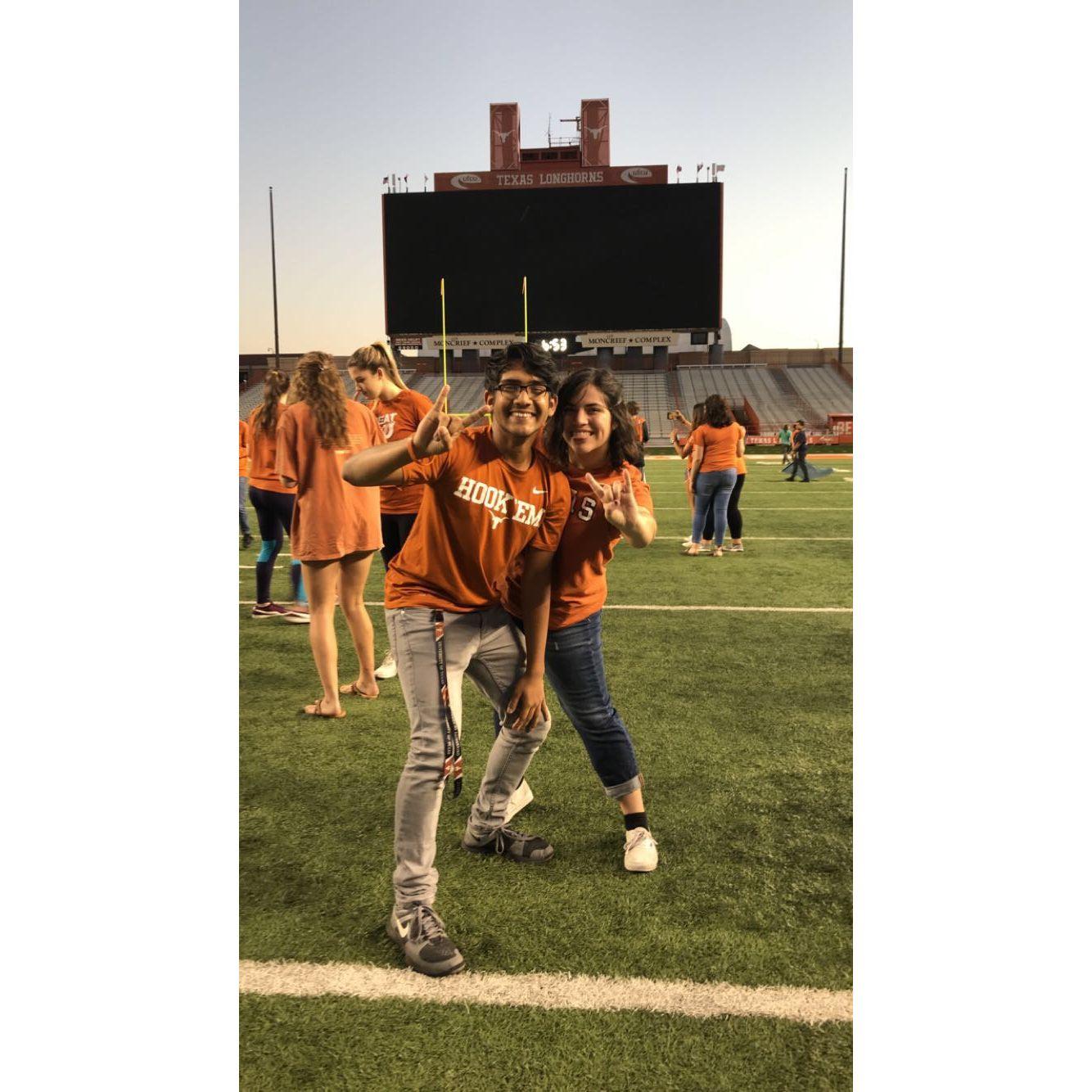 Alexis and Kushal on the Darrell K. Royal Memorial Field.