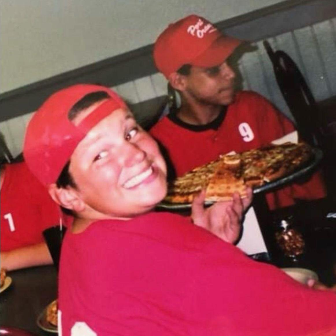 Believe it or not, that's Jose in the back with his Groomsman Travis enjoying a scrumptious pie of pizza.