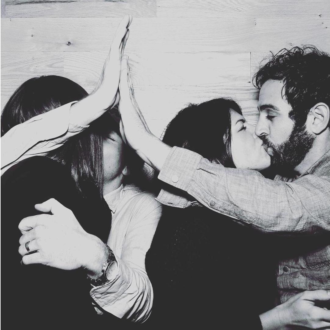 Couple kisses.