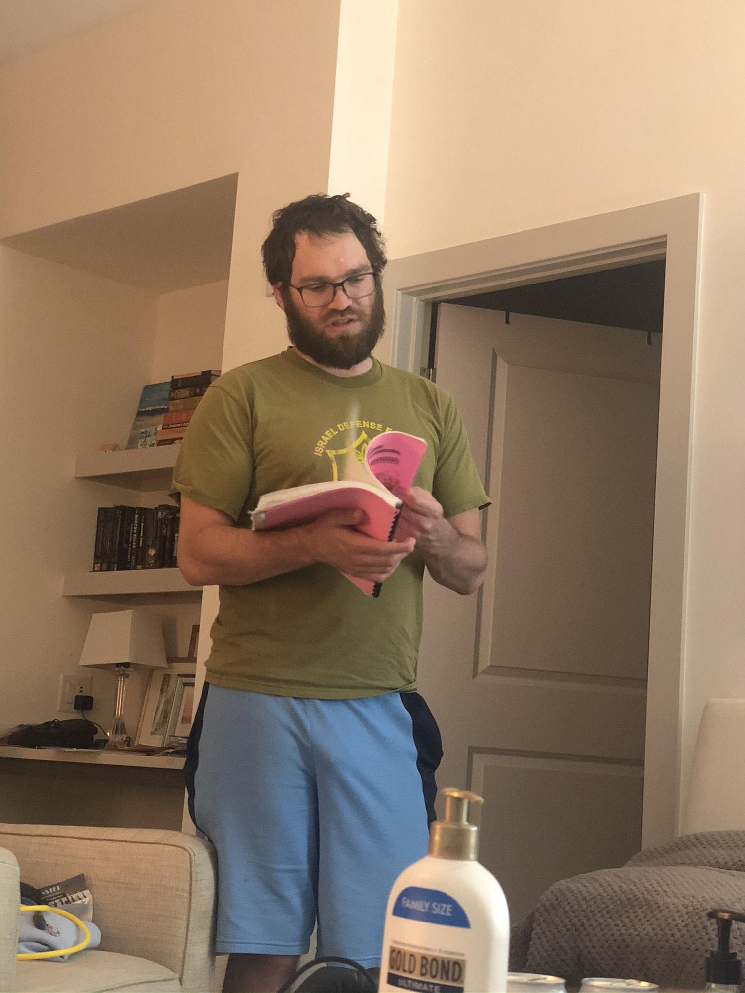 Covid Jono! Reading the virus section of my Bio105 notebook 🦠 That hair and beard! 😳