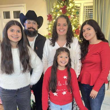 Monica and her husband Pimenio and girls Sele (red), Dulce (white) and flower girl Eli.