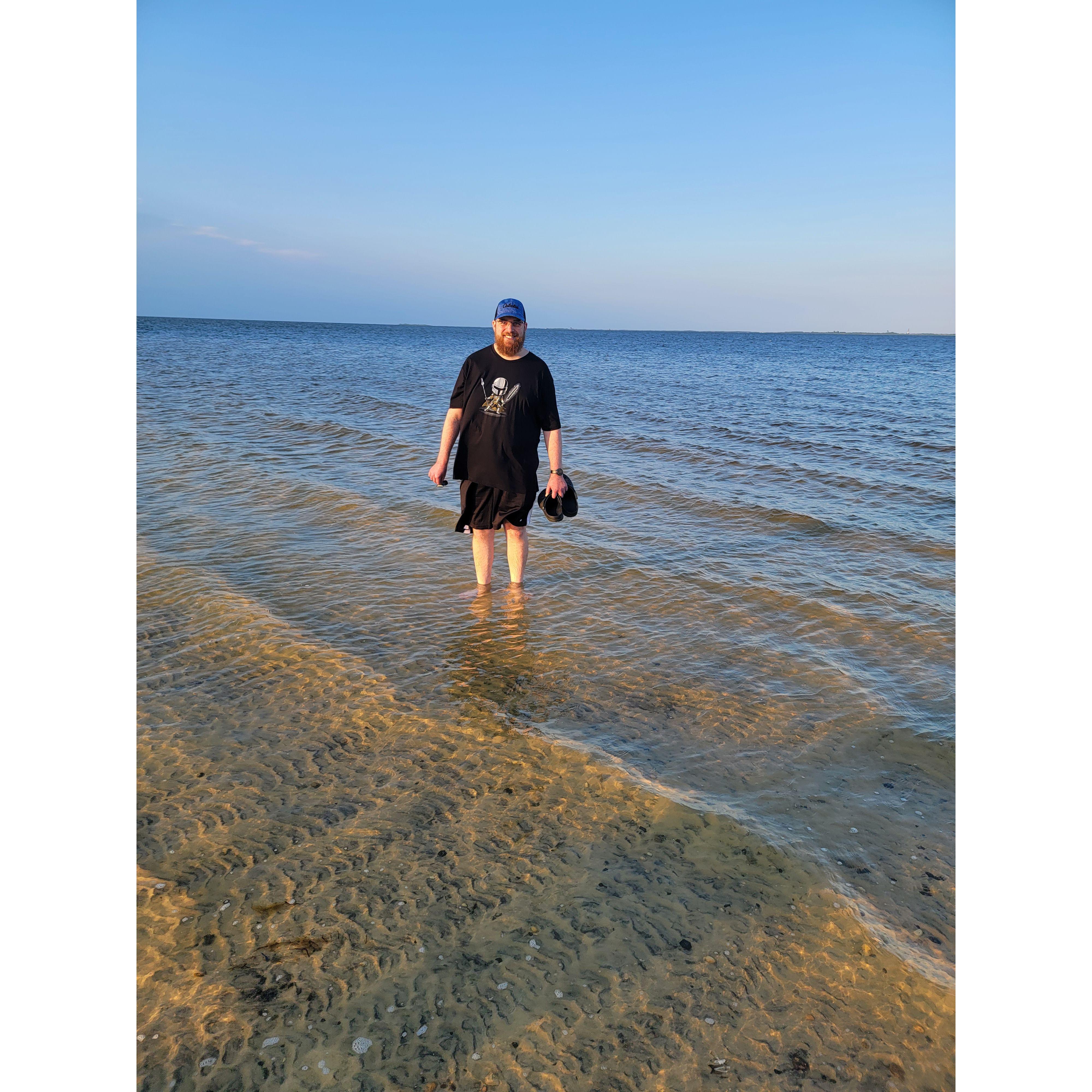 Ryan dipping his feet in at our favorite little beach