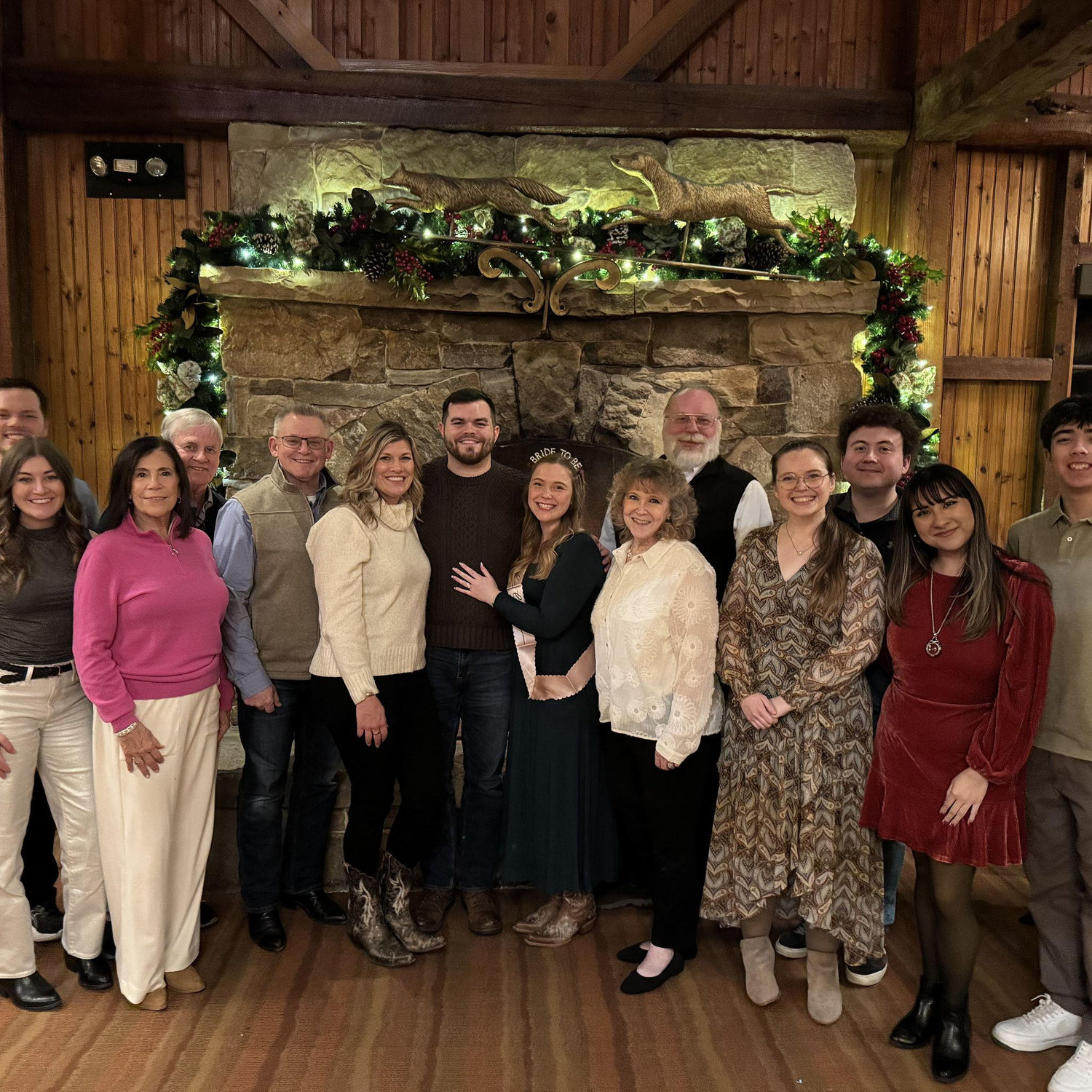 John and Emily celebrating their engagement with family on 12/27/2025