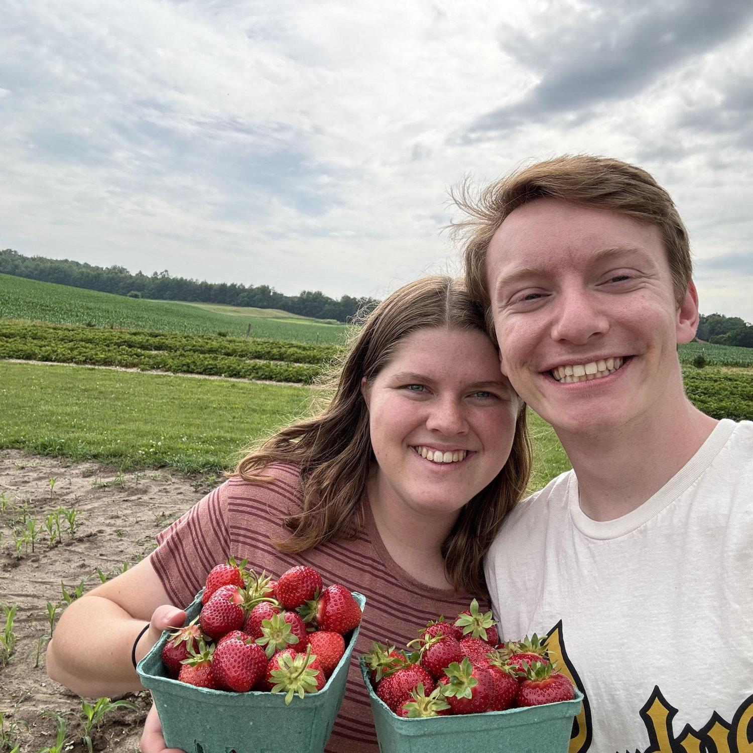 The lovely couple picked some strawberries near Purdue.