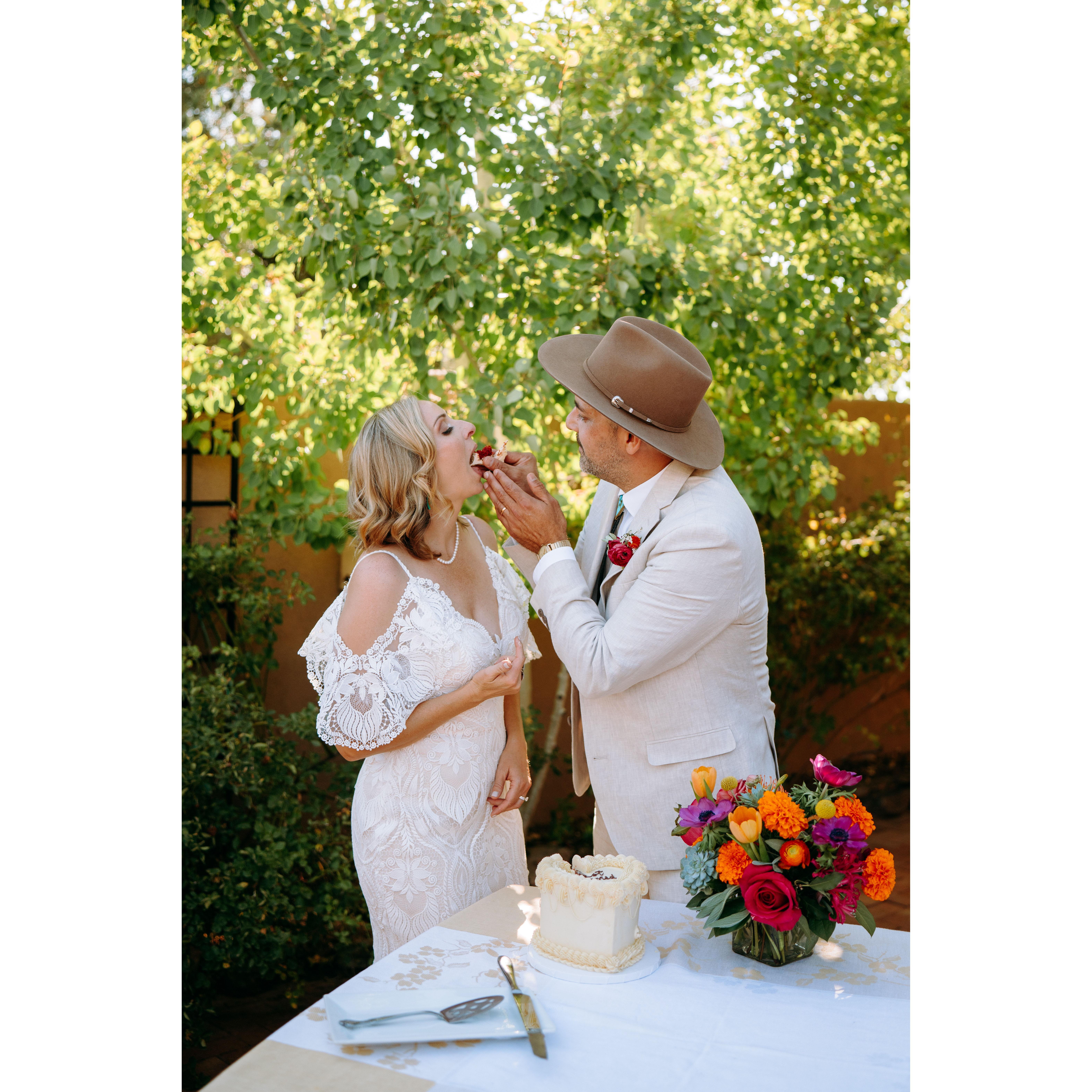 Jenn and Shae have fun eating the wedding cake