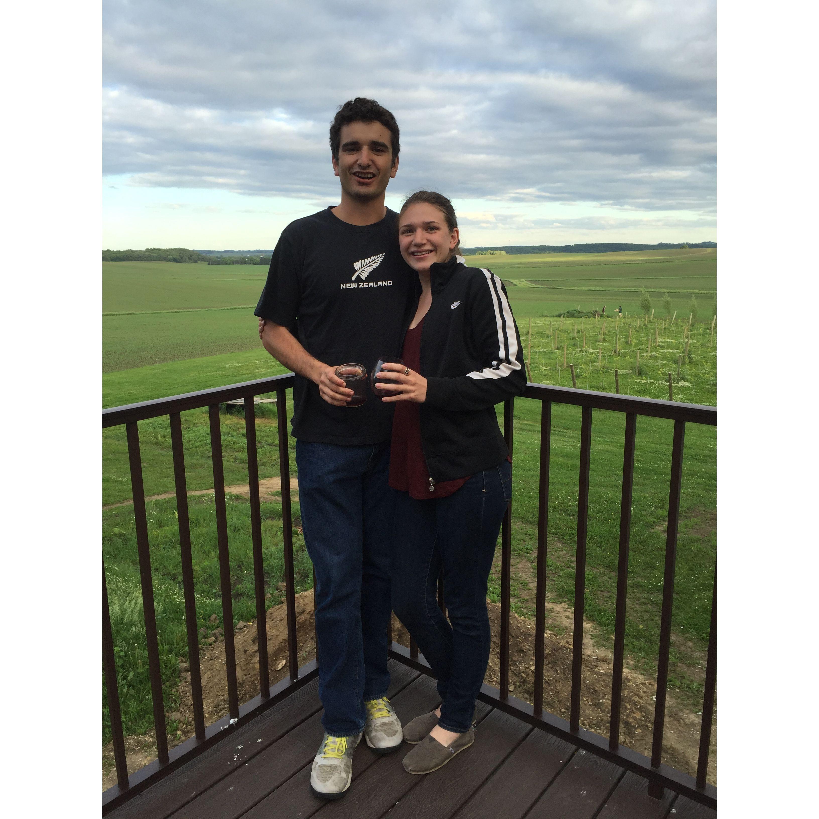 Enjoying our favorite meal - pizza & wine - at Red Barn Farm in Northfield, 2016