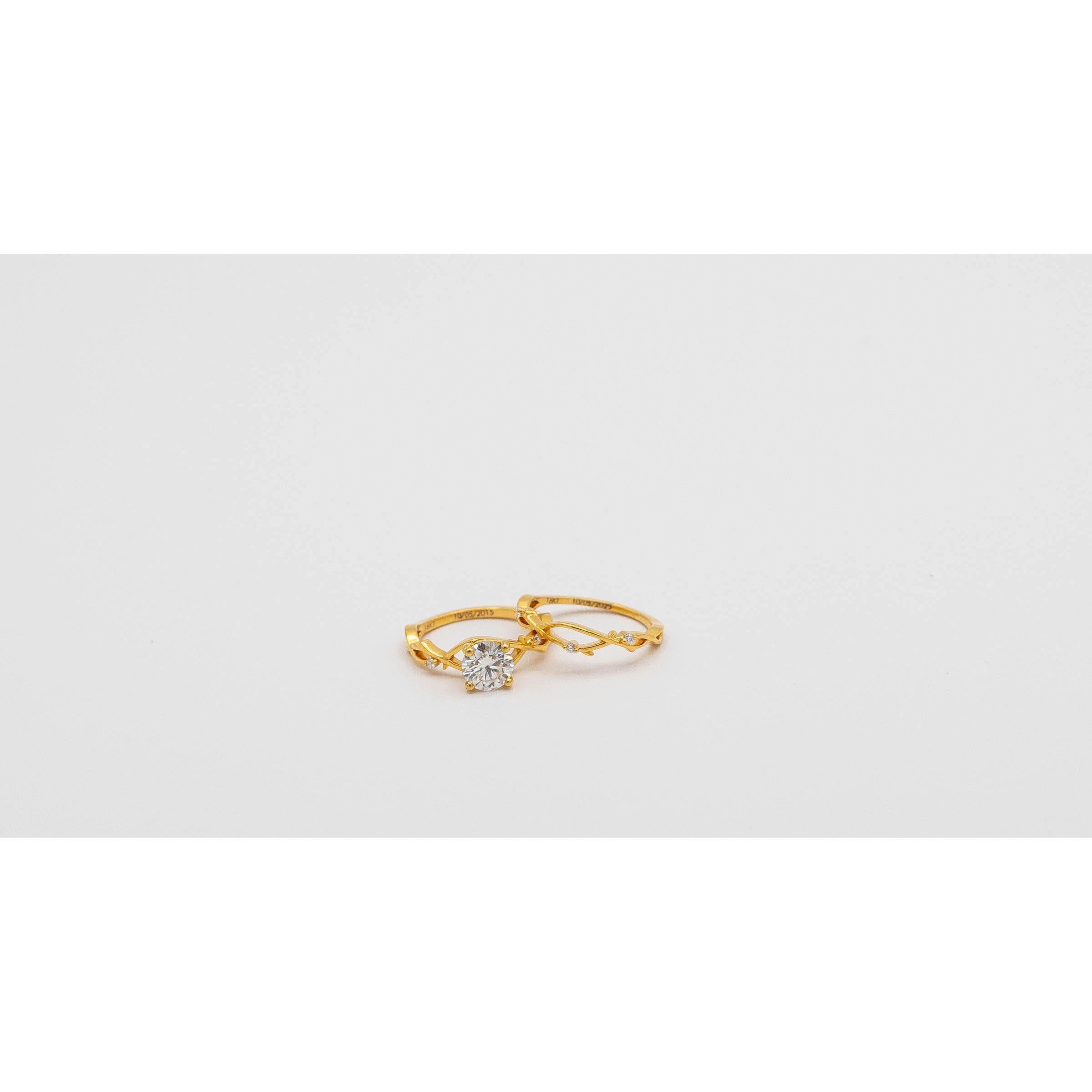 Stephanie's Rings! The engagement ring is engraved with their dating anniversary, while Stephanie's wedding band is engraved with their wedding anniversary.