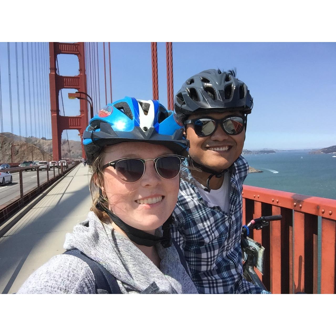 Biking in a tandem bike across the Golden Gate Bridge in San Francisco. After biking across the bridge, Peter and Sarah took the ferry back to the main pier.