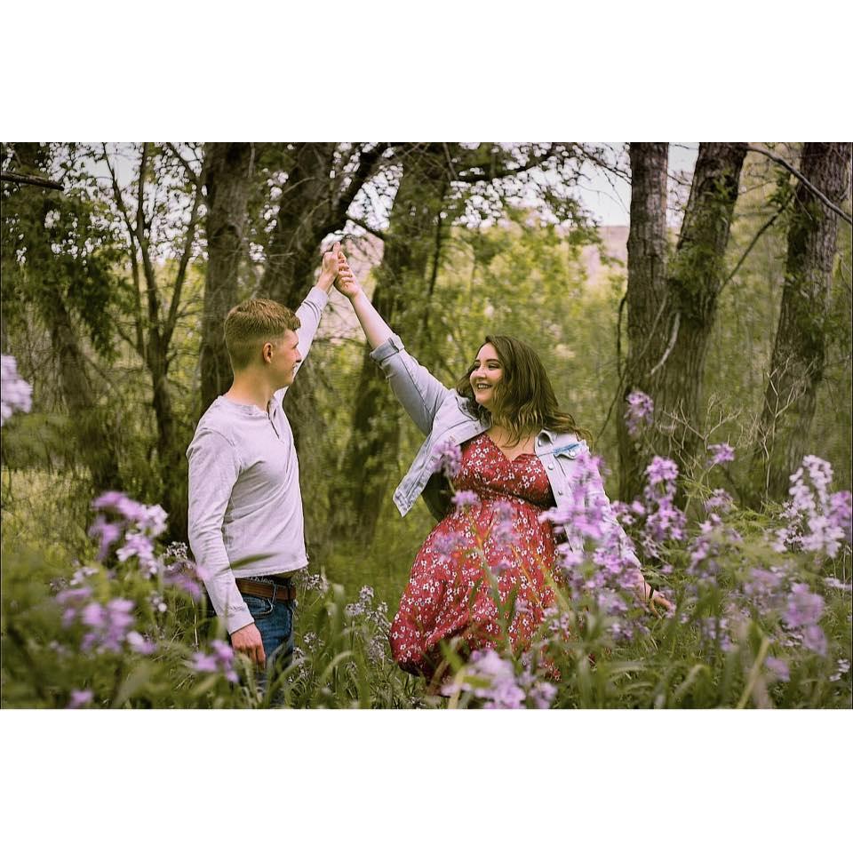 A quiet moment together, dancing among the flowers—a perfect snapshot of love and peace.