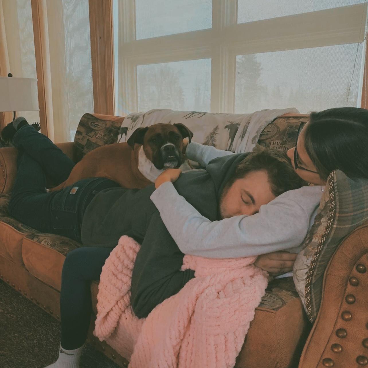 Groomsmen Ben’s dog Molly loves to find the most inconvenient awkward ways to lay on Jared when up in Fort Kent.