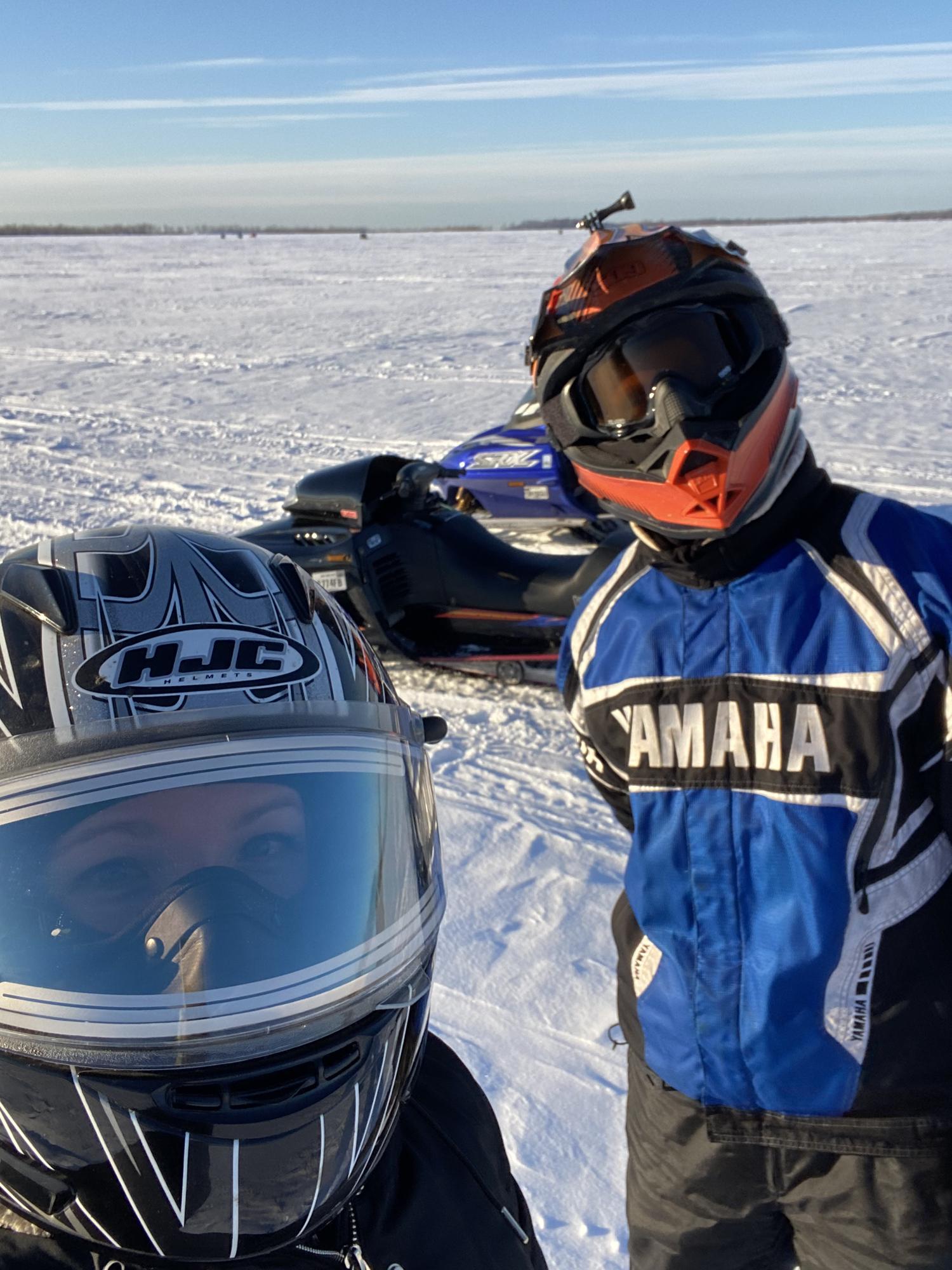Snowmobiling on Sandy Pond