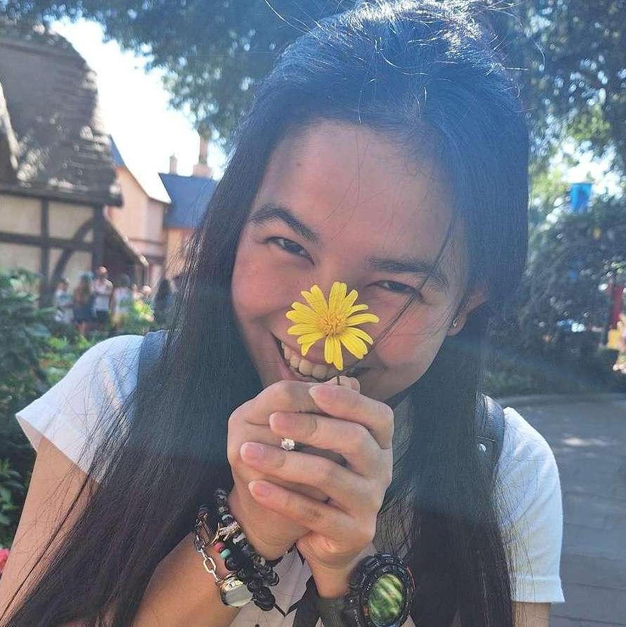 He loves this picture, surrounded by the English Garden at Epcot, again with the flower. I actually think he just likes the picture because of the flower.