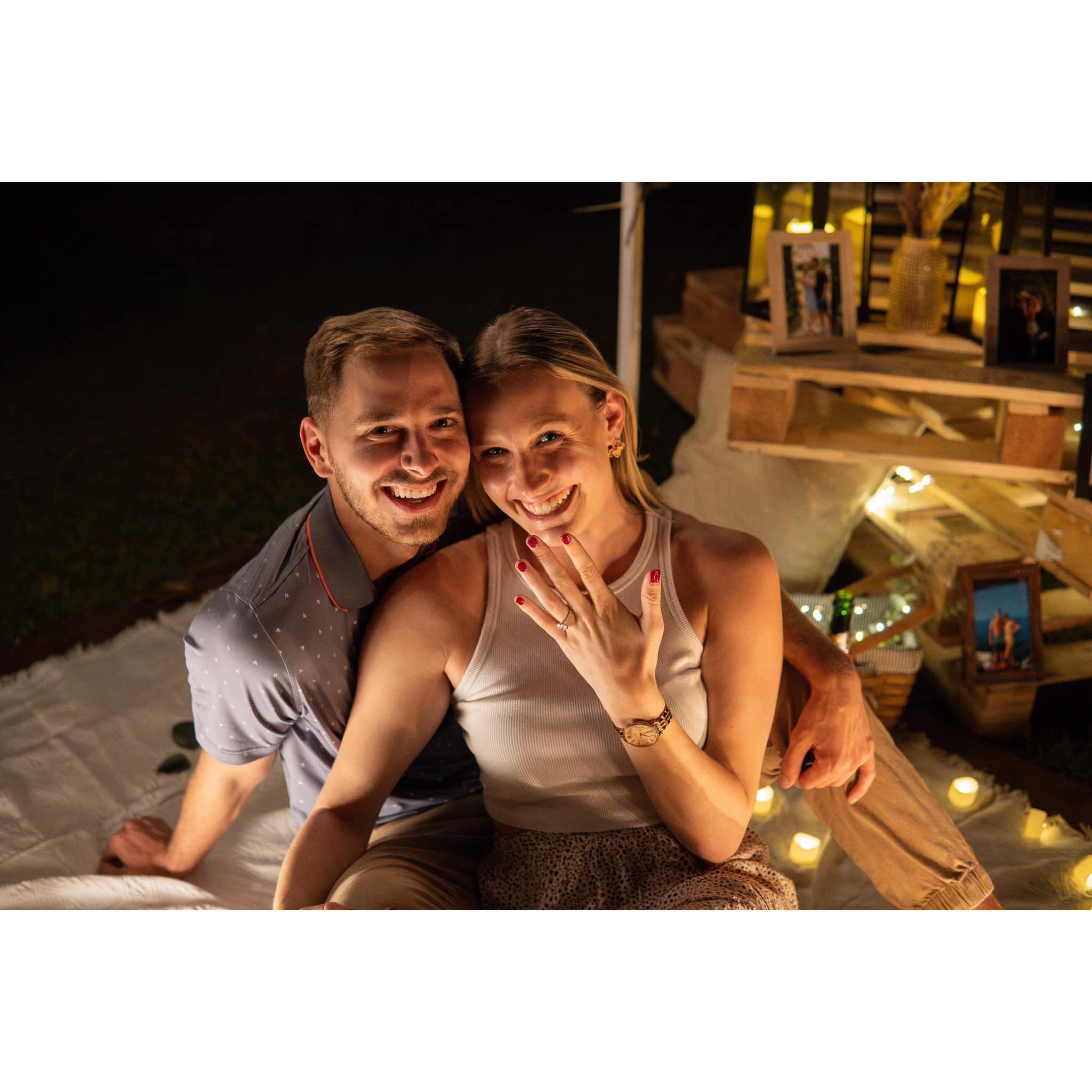Jared proposed on 12/9/23! He pulled off the surprise in his backyard after dinner with his friends in Orlando. Jared planned a celebration with friends who kept the big secret for weeks!