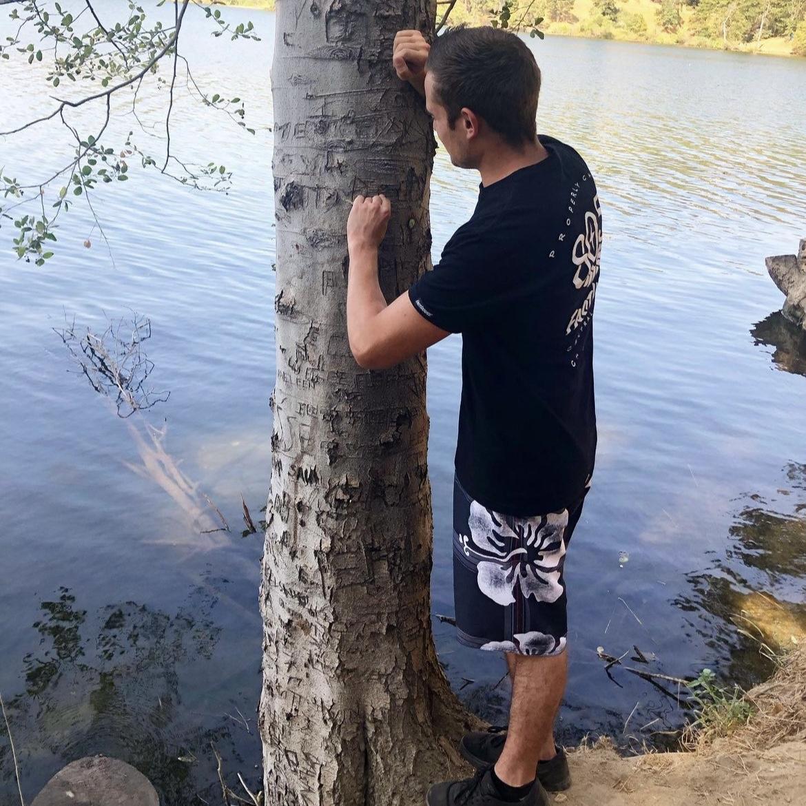 Daniel carving our names into the tree on our third date <3