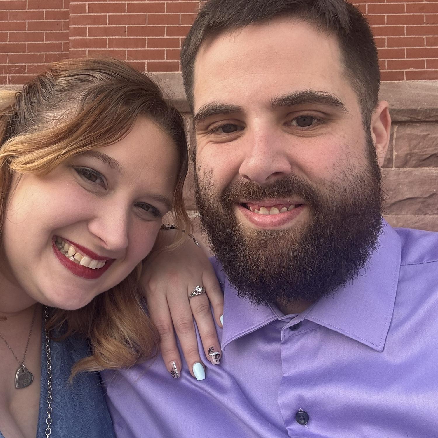 Our engagement photo! Tony took me out for my birthday then we went for a walk. Tony thought we were at a park but we were sitting outside a Catholic Church.