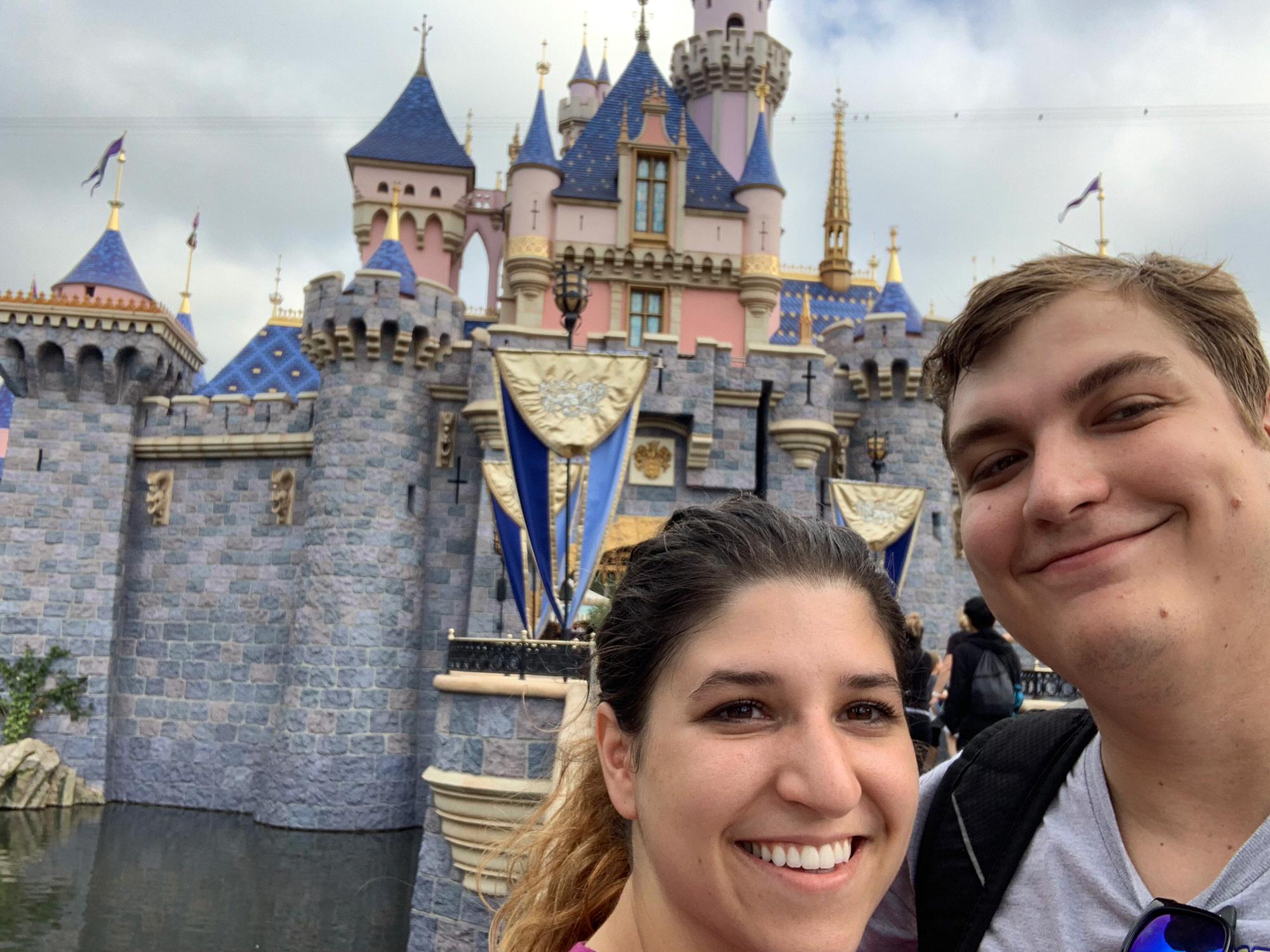 Marina and Conner in front of Sleeping Beauty's Castle in Disneyland